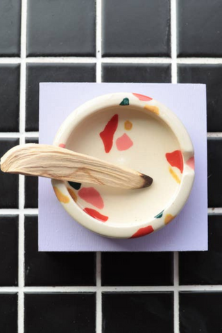 Bringing fresh shapes, cheerful details, and a vibrant wave of colour to any space, Nightshift Ceramic's mission is to make life a little brighter with fun ceramic housewares you can use everyday. This one-of-a-kind stoneware ashtray features a surface design inspired by terrazzo tile. Each is individually glazed and there will be delightful variations in pattern on all pieces. Also great as a jewelry dish or incense burner. Locally made in Toronto, Canada. 